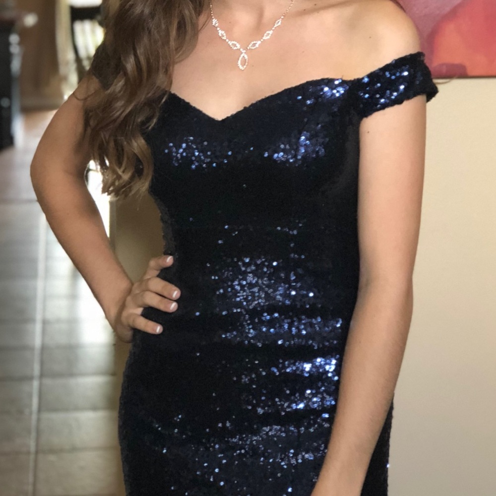 A dark blue sequenced prom dress